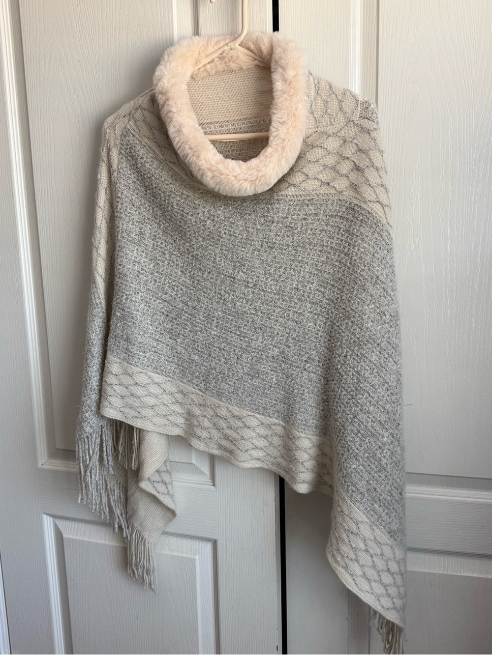 Do everything in Love for Anthropologie faux fur poncho